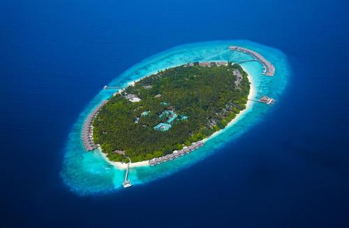 an island in the middle of the ocean at Dusit Thani Maldives in Baa Atoll