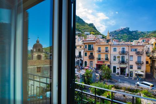 a view of a city from a window at Taormina Bedda Rooms in Taormina