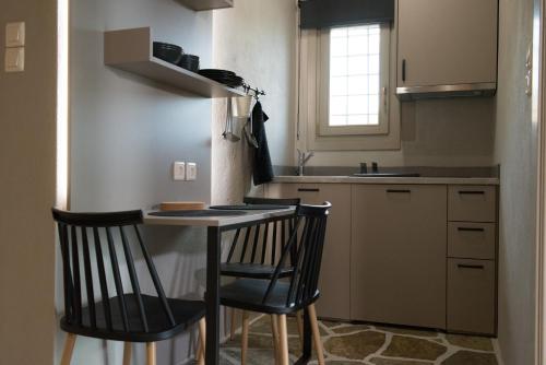 A kitchen or kitchenette at MELIES- Seaside Boutique Apartments