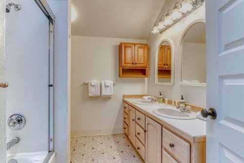 a bathroom with two sinks and a shower at Azusa House in Hood River