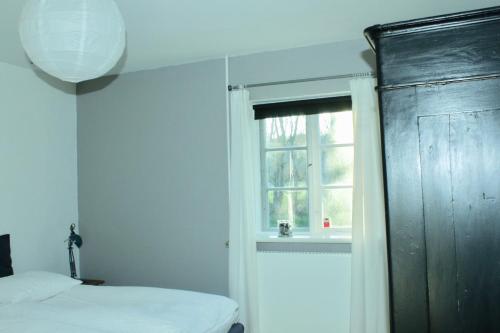 Postel nebo postele na pokoji v ubytování Grastenhus Guesthouse