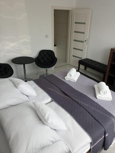 Katil atau katil-katil dalam bilik di Apartmány Urban