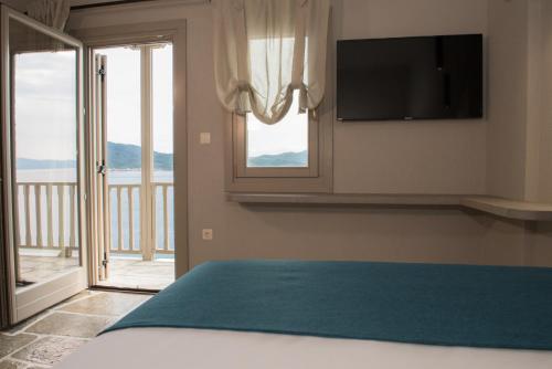 Postel nebo postele na pokoji v ubytování MELIES- Seaside Boutique Apartments