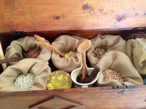 a wooden box filled with different types of food at Masseria Ancella in Montalbano