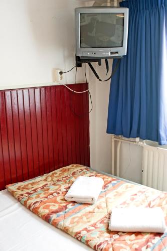 Postel nebo postele na pokoji v ubytování De Mallemoolen