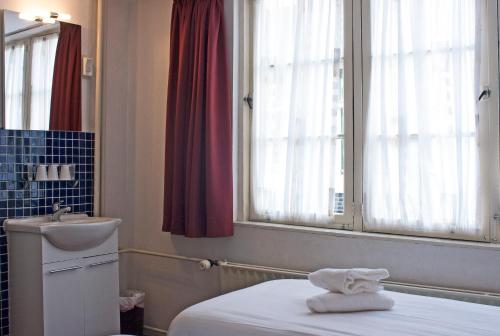 Postel nebo postele na pokoji v ubytování Hotel Torenzicht