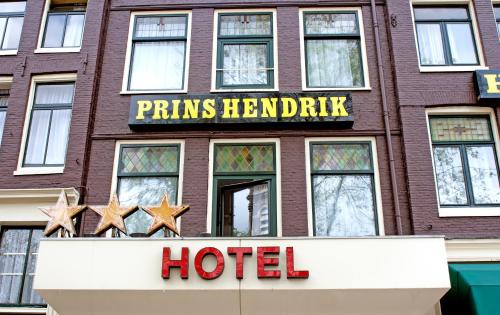 a hotel sign on the side of a brick building at Hotel Prins Hendrik in Amsterdam