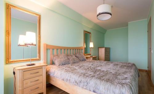 Ένα ή περισσότερα κρεβάτια σε δωμάτιο στο Jõe Apartments - apartments with sauna in the city center