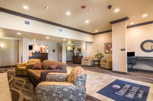 a large living room with couches and a stage at Cobblestone Inn & Suites - Lakin in Lakin
