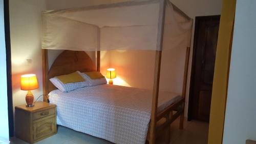 A bed or beds in a room at Keur Lily