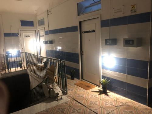 a building with two elevators and two doors with lights at Casa Vacanze Riva Destra in Ischia