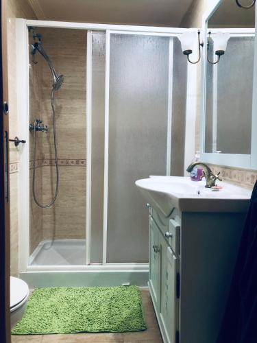 a bathroom with a shower and a sink at Piso lujoso in Puerto de Mazarrón