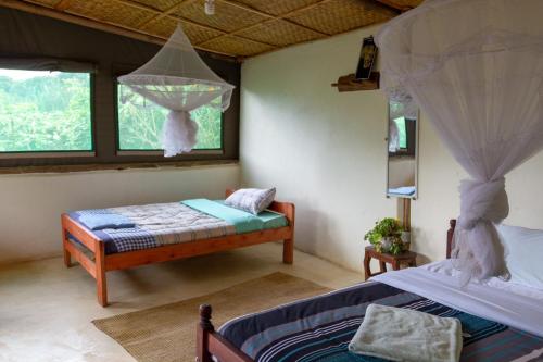 Tempat tidur dalam kamar di Karungi Camp
