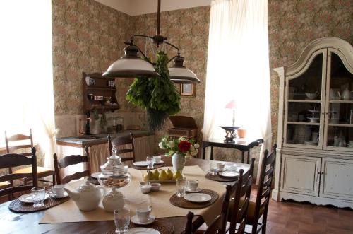 a dining room with a table and a dining room at Liepupe Manor in Liepupe