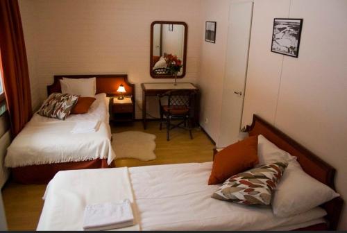Ένα ή περισσότερα κρεβάτια σε δωμάτιο στο Laatokan Portti Apartments