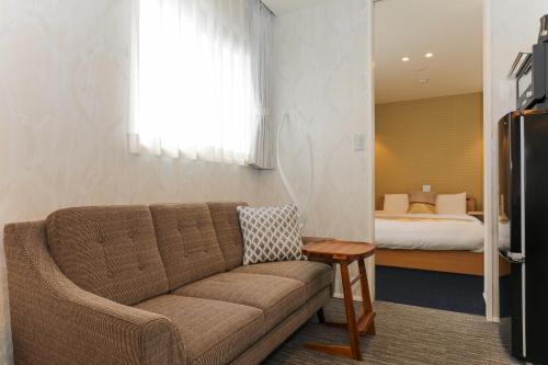 Cama ou camas em um quarto em GRAND BASE Gion