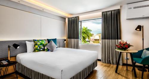 Postel nebo postele na pokoji v ubytování Tanoa Plaza Hotel