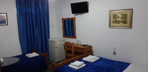 A bed or beds in a room at San Georgio Hotel
