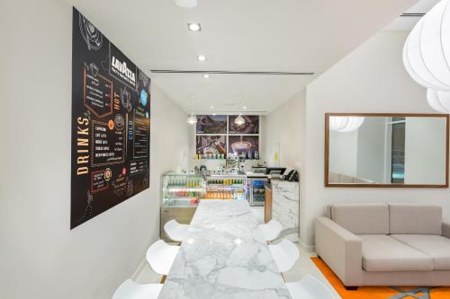 a room with a bar with a couch and a counter at Citymax Hotel Al Barsha in Dubai
