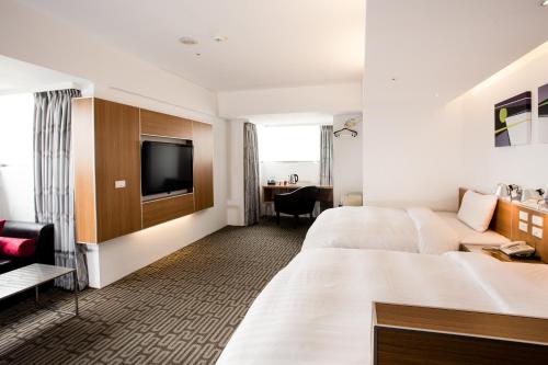 Un pat sau paturi într-o cameră la HOTEL HI - Xinmin