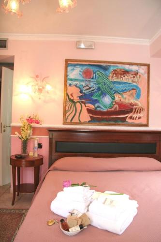 Postel nebo postele na pokoji v ubytování Hotel U' Bais