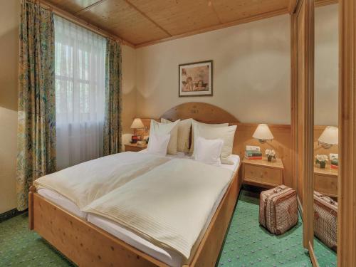 Postel nebo postele na pokoji v ubytování Apart Hotel am Sonnenhügel