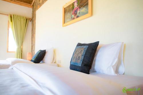 Letto o letti in una camera di Sapa Eco Bungalows & Spa