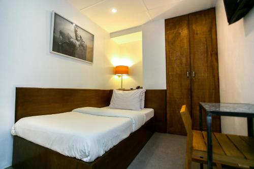 Tempat tidur dalam kamar di Hotel Durban