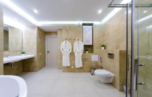 A bathroom at The First Apart Hotel