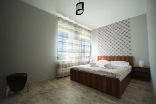 Ліжко або ліжка в номері Apartamenty Piła