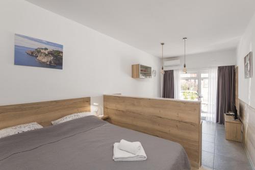 Ένα ή περισσότερα κρεβάτια σε δωμάτιο στο ABC apartments