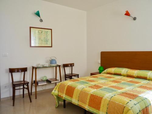 En eller flere senge i et værelse på Borgo Tarapino