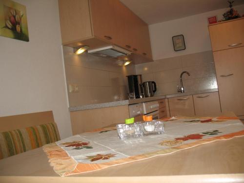a table with glasses on it in a kitchen at Gästehaus Luxner in Strass im Zillertal