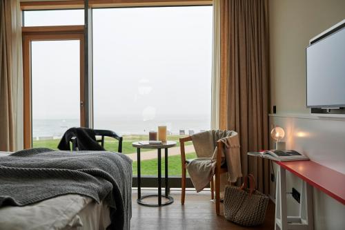 Cama o camas de una habitación en Hotel Haus am Meer