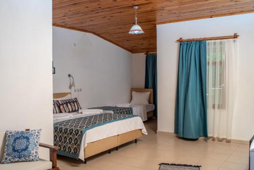 Postel nebo postele na pokoji v ubytování San Simon Hotel