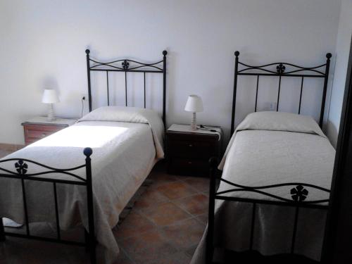 Кровать или кровати в номере Affittacamere Valverde di Pittalis Francesco
