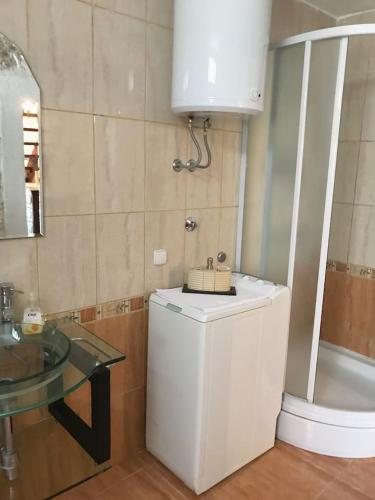 a small bathroom with a sink and a counter with a sink at Dalmatinska kuća Terace in Skradin