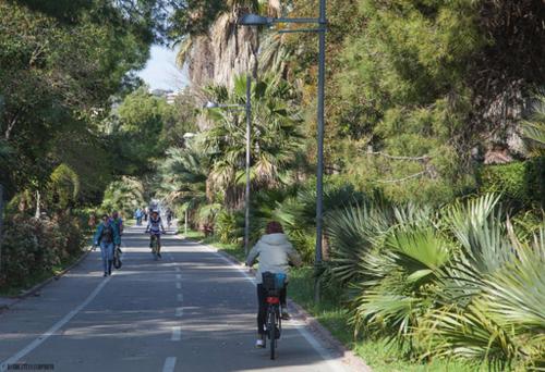 a group of people riding bikes down a road at Casa delle Ginestre Bike in Sanremo