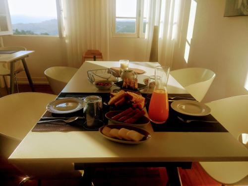 a table with a tray of food on it at Casa da Real Companhia in Lamego
