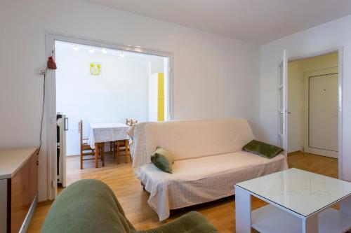 a living room with a couch and a table at Apartment Anna with FREE private parking in Pula