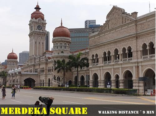 a large building with a clock tower on top of it at Lavana Hotel, Chinatown in Kuala Lumpur