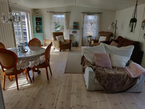 a living room with a couch and a table at Hagi 2 Holiday Home in Hagi