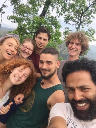 a group of people posing for a picture at Mount Fuji Homestay in Deorāli