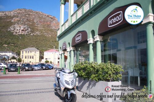 a scooter parked in front of a store at The Muize in Muizenberg