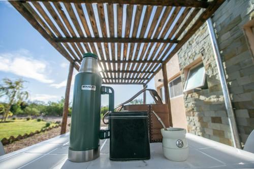 a large green water bottle sitting on a table at Cabañas EcoNature in Valle Grande