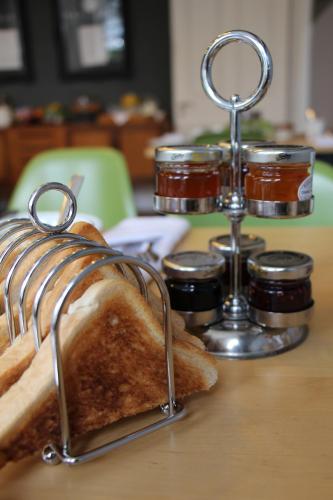 a loaf of bread and jam on a table at Ravilious in Eastbourne