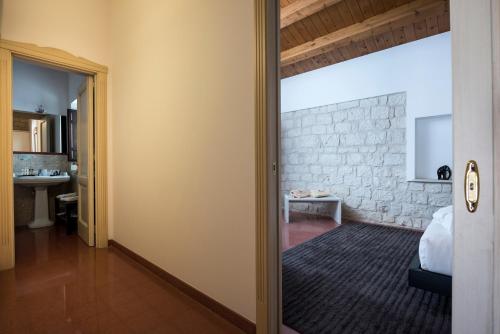 Postel nebo postele na pokoji v ubytování Pietre Nere Resort & Spa