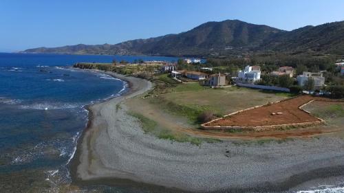 an aerial view of a beach near the ocean at Happy Trails Pomos Panoramic Villa in Pomos