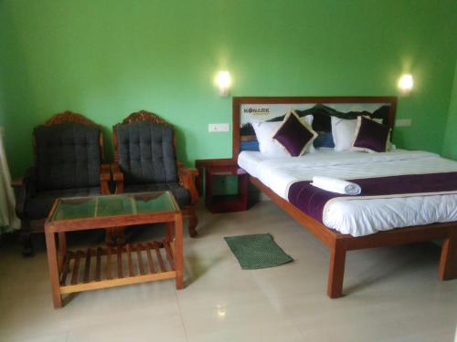 Un ou plusieurs lits dans un hébergement de l'établissement Konark Homestay