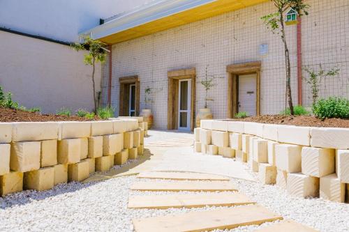 a concrete walkway in front of a building at Ciatu Miu in Noto